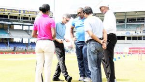 West Indies coach Phil Simmons, along with other match officials, inspects the outfield, West Indies v India, 4th Test, Port of Spain, 4th day, August 21, 2016 ©AFP
