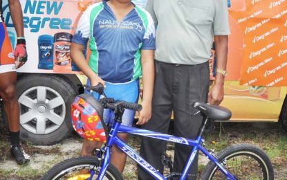 Sue Hang receives BMX cycle compliments of Ricks 7 Sari Agro Ind. Ltd.