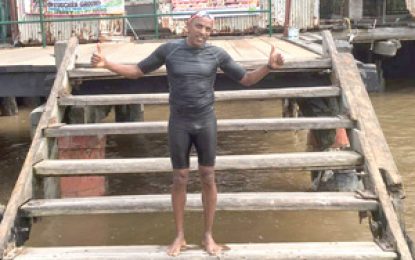 US-based Guyanese swims Demerara River in 24 minutes