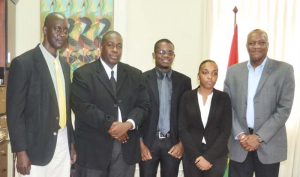 From left: Commissioner and CEO of GLSC, Trevor Benn; students Glendon Greenidge, Joshua Benn and Erica Cappell, and Minister of State Joseph Harmon at the Ministry of the Presidency yesterday.