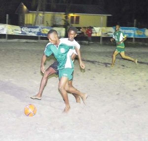 Flashback! Kuru Kururu Warriors Cordel Johnson (ball at feet) takes the attack to Attention Family in March 2016 at the Kuru Kururu Beach Soccer ground in the inaugural Beach Soccer League. 