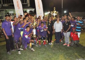Members of the victorious Mabaruma team display their hardware with Minister Carloyn Rodrigues and supporters (Zaheer Mohamed photo).
