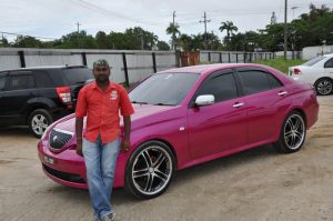 Dragster Anand Ramchand poses with his speed monster Toyota Verossa