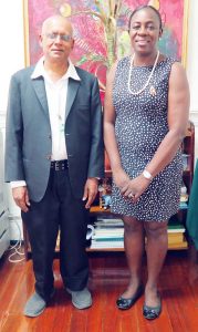 River Conqueror Ashraf Ali and Minister Nicolette Henry at her office.