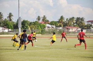 Soca Warriors Under-20 team in control against Alpha United yesterday at the National Track and Field Football Field, Leonora WCD. (Franklin Wilson photo)