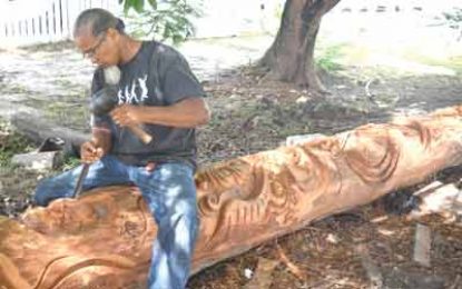 Guyanese sculptor seeks to transform 50-ft log into creative masterpiece