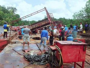 File Photo: Efforts being made recently to remove the sunken dredge in the Mazaruni River.