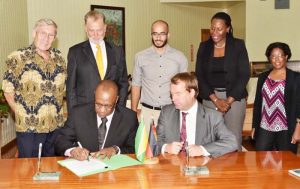 Minister of State, Mr. Joseph Harmon and Germany’s Regional Director for Latin America and the Caribbean, Ambassador Dieter Lamle signing the agreement at the Ministry of the Presidency. Looking on are, from left: Mr. Ben Ter Welle, Ambassador Lutz Hermann Gorgens, Commissioner of the Protected Areas Commission (PAC), Mr. Damian Fernandes, Ms. Ndibi Schwiers-Ceres and Deputy Commissioner at the PAC, Ms. Denise Fraser