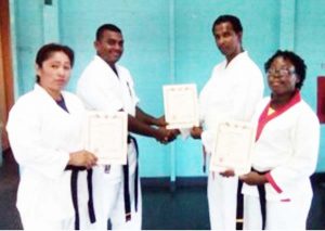 The three instructors receiving their certificate of registration and authorization.