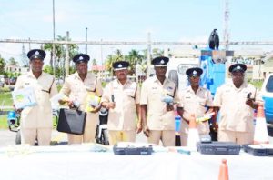 Traffic Chief, Dion Moore (centre) and ranks of the Guyana Police Force’s Traffic Department with the newly acquired radar guns, breathalyser kits, flashing wands, traffic cones and reflector vests to be used in Operation Safeway.