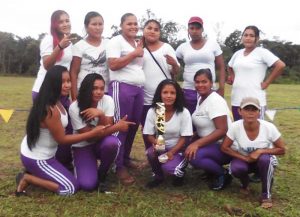 Members of the Oronoque softball team with their hardware. 