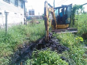 This excavator was used to clear a bush infested drain in the community.
