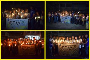 Participants of the candle light vigil in observance of World Suicide Prevention Day