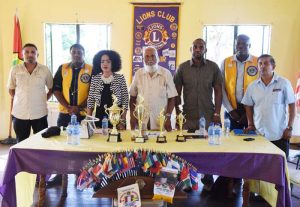 President of the Bel Air Lions Club Fazal Hamid (2nd left) and President of the GDA Faye Joseph (on his immediate left) poses with Lions and GDA representatives yesterday.