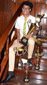A smiling Kayshav Tewari displays his trophies. (Photo credit: Courdel Jones)