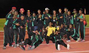 DOMINANCE! The 2016 victorious IGG ‘Goodwill’ Athletics team pose for a photo opportunity after dominating the competition against Suriname.