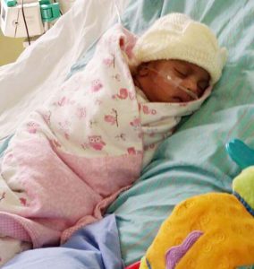 A recovering Baby Naiyah Kissoon takes a nap.