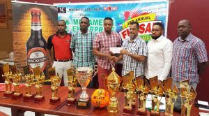 Sharif Major (left) New Era Co-Director collects the Mohamed’s Enterprise sponsorship from Mr. Nazar Mohamed yesterday, while sharing the moment are (from left) Ansa McAl’s Jamal Douglas, Aubrey Major Jnr and Kenrick Noel of New Era and Mark Young of the Futsal Association.