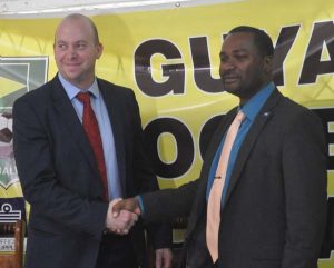 New TD Ian Greenwood is welcomed by GFF President Wayne Ford at a Media briefing yesterday.