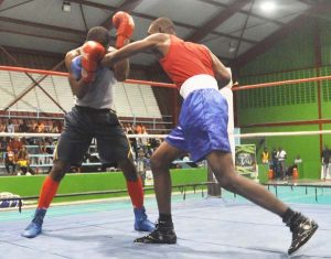 Police’s Dewani Lamphin penetrates REP’s Klaus Daniels defence before both Boxers were disqualified for hitting after the bell. (Sean Devers photo)