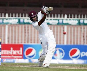 Roston Chase drives through the off-side en route to his maiden Test half-century on Monday. (Photo courtesy WICB Media)
