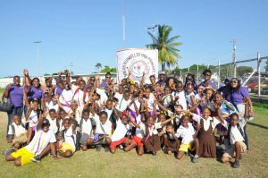 SIX IN A ROW! South Ruimveldt Primary School celebrate winning a sixth South Georgetown Primary Schools’ athletics title yesterday at the Police Sports Club Ground, Eve Leary.