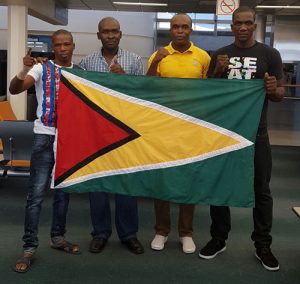The triumphant boxers and management team: (from left)  Claremont `Kartel' Gibson, Coach Adrian Thomas, Director  of Prison Carl Graham and Jason 'AK 47' Barker