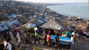 In Jeremie, Haiti, Hurricane Matthew claimed the life of a pregnant woman, whose remains were carried in a coffin by local residents on Friday, October 7, 2016. (CNN photo) 