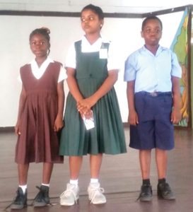 The winners of the competiton in the primary division. From left Rehanna Grant of St. Therese’s Primary the top prize; Mera Jagarnauth, of Gangaram Primary, the runner up position; and Ezra Minty of Sheet Anchor Primary, the third spot.