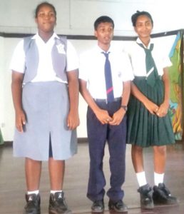 From left, Ashyanna Khan of Tutorial Academy, the first runner up; Ray Persaud of Berbice High School, the winner, and Rita Persaud of Canje Secondary, the second runner up.