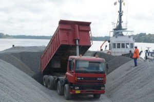 The barge Mariner’s 1 Kingston being loaded in Paramaribo last month for the first shipment of crushed stone for the CJIA expansion project. (File photo)