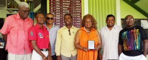 Ira ‘Lady Ira’ Lewis (third right) poses with some members of the Guyana Committee of Services. From left are Eugene Noel, Young Bill Rogers, Joseph Ramkumar, boxer Clive Atwell, Rajan Tiwari and Leslie Black.