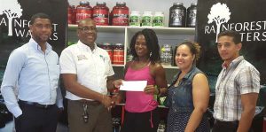 Clive Pellew (2nd left) of Banks DIH presents his company’s sponsorship package to Noshavyah King, in the presence of (from left) Errol Nelson, Jordana Ramsey-Gonsalves and Jamie McDonald.