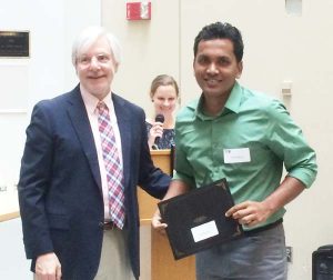 Receiving an award from the Dean of Harvard School of Public Health.