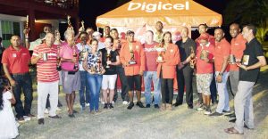 Prizes winners pose with their trophies and prizes following the presentation ceremony yesterday at the Lusignan Course.
