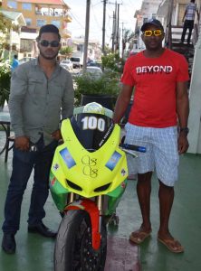 Superbike racer Joel Neblette (right) poses with sponsor Leon Dorado of Leon Dorado Int’l Hotel & Bar and his Suzuki 600 cc monster at the sponsor’s location yesterday. 