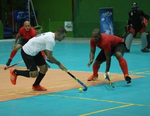 Toronto Lions star player Jonathan Roberts (centre) attempts to dribble past Old Fort’s Dwight Sullivan (right) and Christopher Low-Koan during their encounter on Friday.