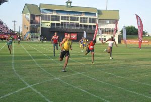 Linden’s Compton Caesar brings home the gold for his team in the Boys’ U-20 4x100m.