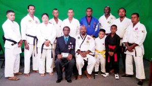 Grandmaster Stephen Monasingh (seated left) and Max Massiah (seated right) along with other Martial Artists at last Friday’s programme on NCN.