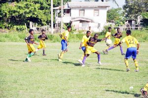 Tussle for possession between Diamond United and Circuit Ville Jaguars on Saturday at the Grove Playfield.