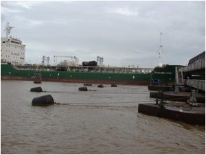 A vessel making its way through the opening in the Demerara Bridge