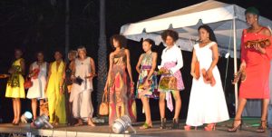 Models display locally made outfits, footwear and clutch purses. 