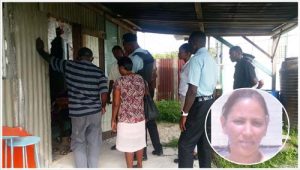 Relatives and the police yesterday as they searched for evidence of Shawnette Savory (Inset)