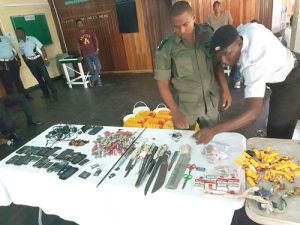 Joint Services members going through the contraband seized yesterday morning at the Georgetown Prisons.