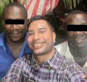 The two detectives photographed with Bisram, who is implicated in Narinedatt’s murder.