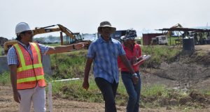 From left: Environmental Engineer Satrohan Nauth, Suresh Jagmohan and an employee of Jagmohan Construction