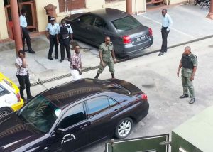 Michael Caesar (wearing white pants) leaves the High Court after being sentenced.