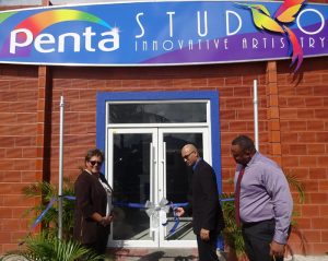 (From left) Ansa McAl Managing Director, Beverly Harper cuts the ribbon with GCCI President Vishnu Doerga as Marketing Director of Ansa McAl, Troy Cadogan looks on