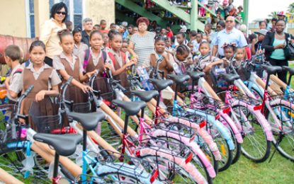 Minister Ally distributes 25 bicycles to Parfait Harmonie pupils