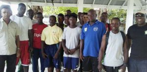 GBA President Steve Ninvalle (right) is all smiles as he poses with members of the team yesterday. Other officials in photo are Sebert Blake (2ndright), Clifton Moore (4th left) and Maurice Rajkumar (extreme left)